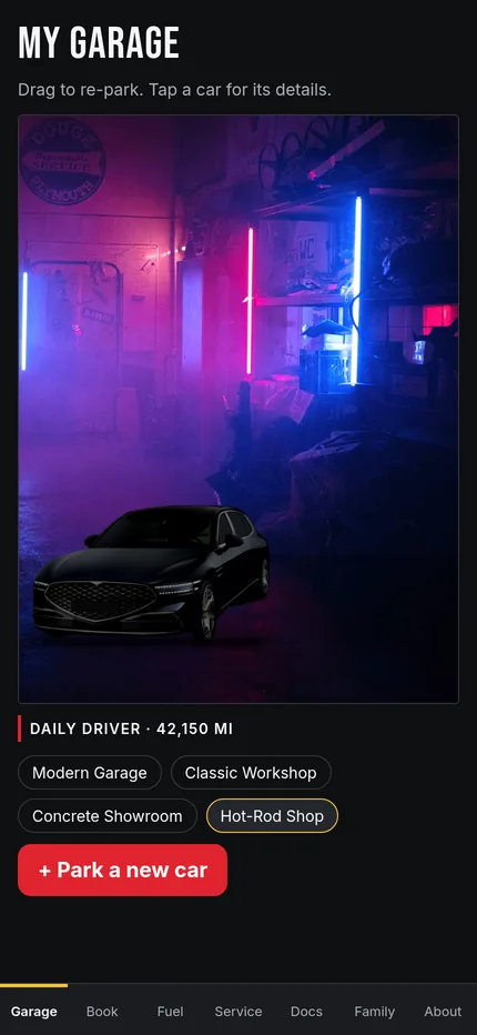 A car in a neon-lit hot rod shop